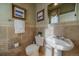 Powder room with pedestal sink and tiled walls at 4231 W 105Th Way, Westminster, CO 80031