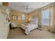 Bright bedroom with carpeted floor, neutral walls, and a comfortable bed at 4231 W 105Th Way, Westminster, CO 80031