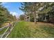 Landscaped backyard with a wooden fence and mature trees at 4231 W 105Th Way, Westminster, CO 80031