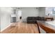 Living space with hardwood floors and view to kitchen at 12131 Melody Dr # 101, Denver, CO 80234