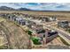An aerial shot of homes with solar panels, fenced backyards, and desert views at 9559 Yucca Way, Arvada, CO 80007