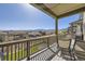 Relaxing outdoor deck area with seating and stunning mountain views in a desirable community at 9559 Yucca Way, Arvada, CO 80007