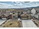 Stunning two-story home with a three-car garage, stone accents, and well-manicured landscaping at 9559 Yucca Way, Arvada, CO 80007