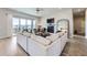 Spacious living room features a cozy fireplace, hardwood floors, comfortable seating, and a sliding door to a balcony at 9559 Yucca Way, Arvada, CO 80007