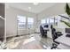 Modern office space with great natural light, sit-stand desks, hardwood floors, and mountain views at 9559 Yucca Way, Arvada, CO 80007