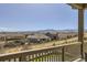 Scenic view from the home's balcony overlooking the neighborhood, mountains, and surrounding landscape at 9559 Yucca Way, Arvada, CO 80007