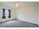 Spacious bedroom with vaulted ceiling, ceiling fan, gray carpet, and window with mountain view at 16645 W 2Nd Ave, Golden, CO 80401