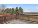 Wooden deck with mountain views, and wooden railing at 16645 W 2Nd Ave, Golden, CO 80401