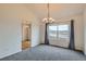 Open dining room featuring new carpet and large windows with natural light at 16645 W 2Nd Ave, Golden, CO 80401