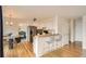 Well-lit kitchen with hardwood floors, stainless steel appliances, and a breakfast bar at 16645 W 2Nd Ave, Golden, CO 80401