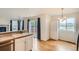 Bright kitchen featuring hardwood floors and stainless steel appliances, overlooking the deck at 16645 W 2Nd Ave, Golden, CO 80401