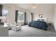 Bright main bedroom with vaulted ceiling, ceiling fan, large window and comfortable furniture at 16645 W 2Nd Ave, Golden, CO 80401