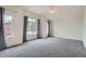 Bright main bedroom with vaulted ceiling, ceiling fan, and large windows with views at 16645 W 2Nd Ave, Golden, CO 80401
