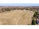 Landscape view showcases open space area and walking path with city views far away at 9239 Erminedale Dr, Lone Tree, CO 80124