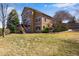 Expansive backyard with lush green grass and a multi-level deck at 9239 Erminedale Dr, Lone Tree, CO 80124
