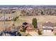 Beautiful home with solar panels, set against a scenic landscape and distant city views at 9239 Erminedale Dr, Lone Tree, CO 80124