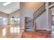 Open foyer with hardwood floors and a grand staircase at 9239 Erminedale Dr, Lone Tree, CO 80124