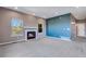 Cozy living room featuring a fireplace, ample natural light, and neutral tones at 9239 Erminedale Dr, Lone Tree, CO 80124