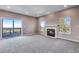 Comfortable living room with a fireplace and sliding door to the deck at 9239 Erminedale Dr, Lone Tree, CO 80124