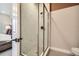Modern shower with marble tile and glass enclosure at 1756 Peak Loop, Broomfield, CO 80023