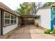 Spacious concrete patio and pergola offer an outdoor area with privacy fence at 1341 Chester St, Aurora, CO 80010