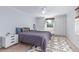Comfortable bedroom featuring a large bed, white trim, and generous natural light at 1341 Chester St, Aurora, CO 80010