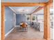 Stylish dining room with a modern chandelier, and seamless flow into the kitchen at 1341 Chester St, Aurora, CO 80010