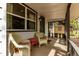 Inviting covered front porch with comfortable seating and stylish decor at 1341 Chester St, Aurora, CO 80010
