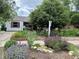 Landscaped front yard with colorful flowers, rock features, and a well-maintained lawn enhance curb appeal at 1341 Chester St, Aurora, CO 80010