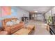 Comfortable living room seamlessly connects to the modern kitchen with natural light and a relaxed setting at 1341 Chester St, Aurora, CO 80010