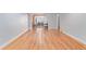Spacious living room with hardwood floors and decorative archway entrance at 1341 Chester St, Aurora, CO 80010