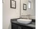 Close-up of a stylish bathroom sink with modern fixtures and a sleek vanity at 3845 N Raleigh St, Denver, CO 80212