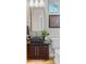 Modern bathroom featuring a black vessel sink, granite countertop, and stylish fixtures and decor at 3845 N Raleigh St, Denver, CO 80212