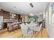 Bright, open living space with dining area, kitchen with an island, and modern furniture at 3845 N Raleigh St, Denver, CO 80212