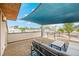 Rooftop patio offering city views, complete with comfortable seating and a shade covering at 3845 N Raleigh St, Denver, CO 80212