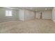 Spacious carpeted basement with recessed lighting and multiple doorways at 6070 Long Branch Dr, Parker, CO 80134