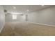 Large finished basement with recessed lighting, carpet, and a small window at 6070 Long Branch Dr, Parker, CO 80134