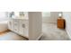 Bright bathroom features double vanities, a soaking tub, neutral paint and flooring at 6070 Long Branch Dr, Parker, CO 80134