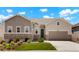 Charming single-Gathering home showcasing a well-manicured lawn, neutral tones, stone accents, and a two-car garage at 6070 Long Branch Dr, Parker, CO 80134