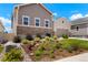 Landscaped front yard with flower beds and healthy, flowering vegetation adding curb appeal to this lovely home at 6070 Long Branch Dr, Parker, CO 80134