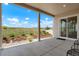 Covered patio showcases a private landscaped backyard and an adjacent grassy area at 6070 Long Branch Dr, Parker, CO 80134
