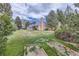 Large backyard with brick planters at 3240 E 128Th Pl, Thornton, CO 80241