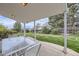 Covered back patio with a table and chairs overlooking the backyard at 3240 E 128Th Pl, Thornton, CO 80241