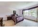 Bright bedroom with a plush carpet, a window with decorative curtains, and matching furniture at 3240 E 128Th Pl, Thornton, CO 80241