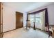 Simple bedroom with classic carpet, large window, and furniture at 3240 E 128Th Pl, Thornton, CO 80241