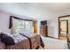 Cozy bedroom with a large window, comfortable carpet, and stylish furniture at 3240 E 128Th Pl, Thornton, CO 80241