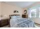 Cozy bedroom featuring a comfortable bed, side tables and natural light at 3240 E 128Th Pl, Thornton, CO 80241