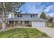 Charming two-story home with a well-maintained lawn and a two car garage at 3240 E 128Th Pl, Thornton, CO 80241