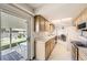 Bright kitchen with a slider to the back yard, wood cabinets and stainless steel appliances at 3240 E 128Th Pl, Thornton, CO 80241