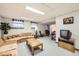 Spacious finished living room with sofas, television and windows at 3240 E 128Th Pl, Thornton, CO 80241